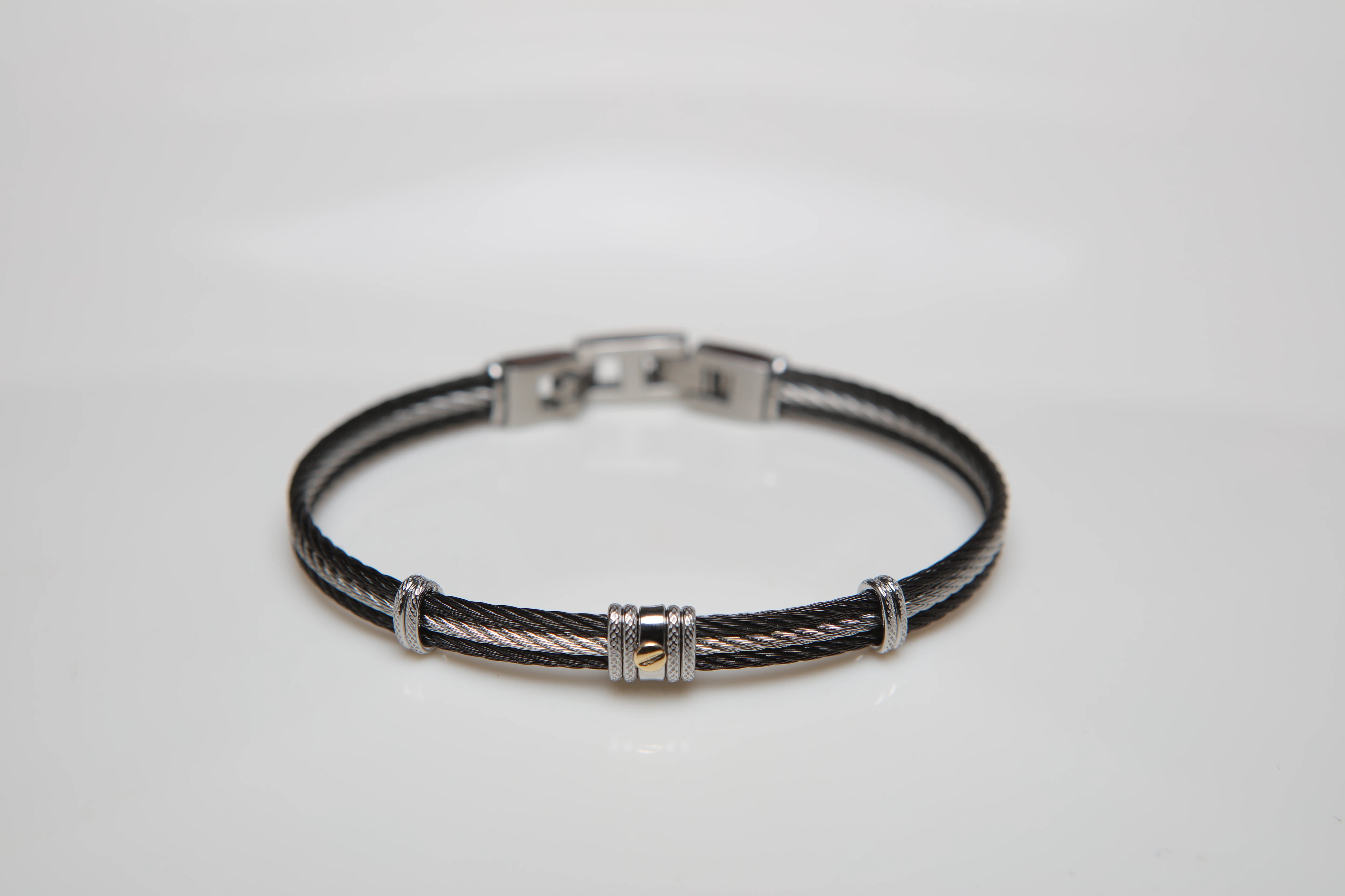 Bracelet with black and white PVD steel cable with central gold screw in 18Kt