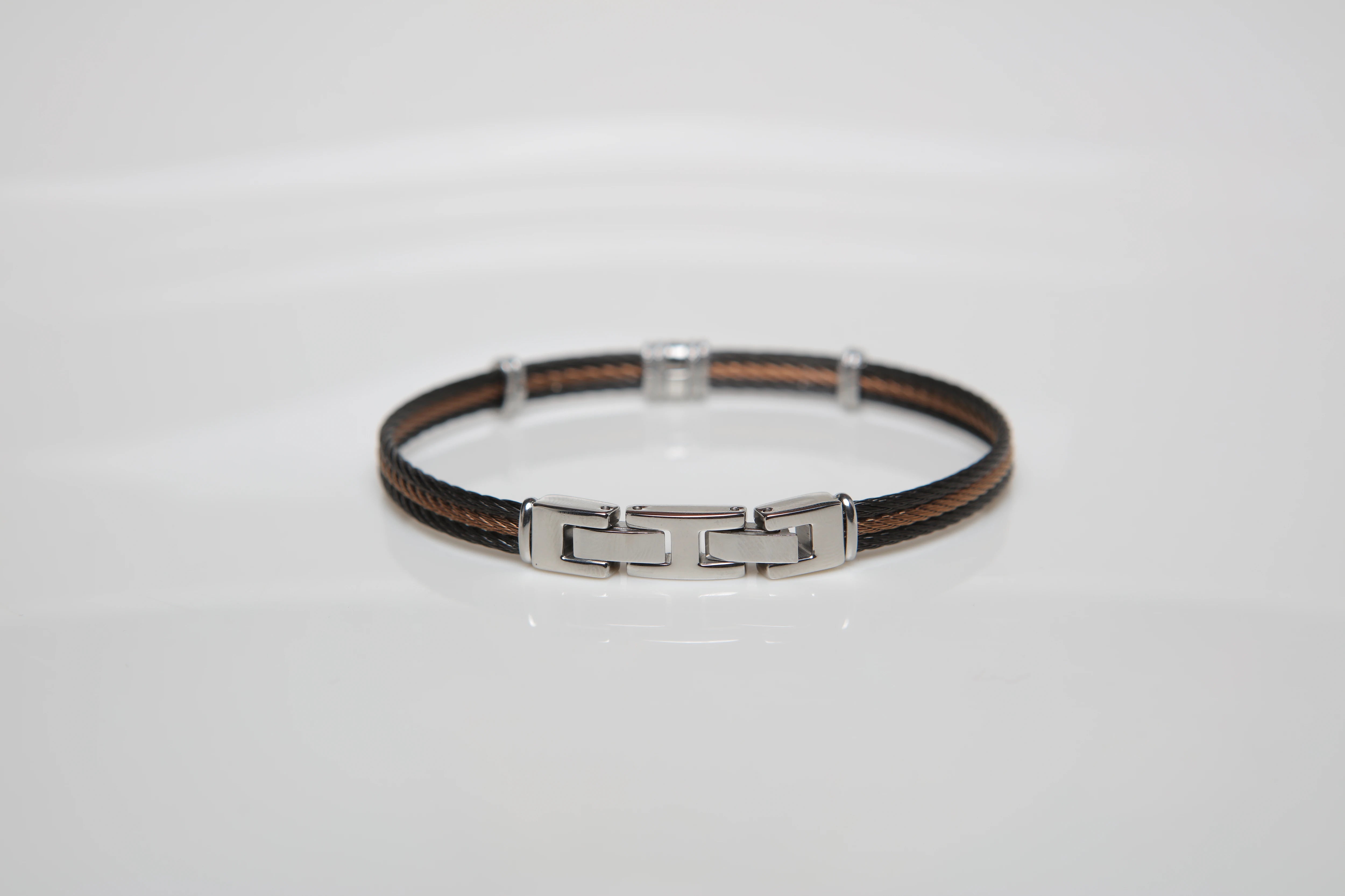 Bracelet with black and brown PVD steel cable with central gold screw in 18Kt