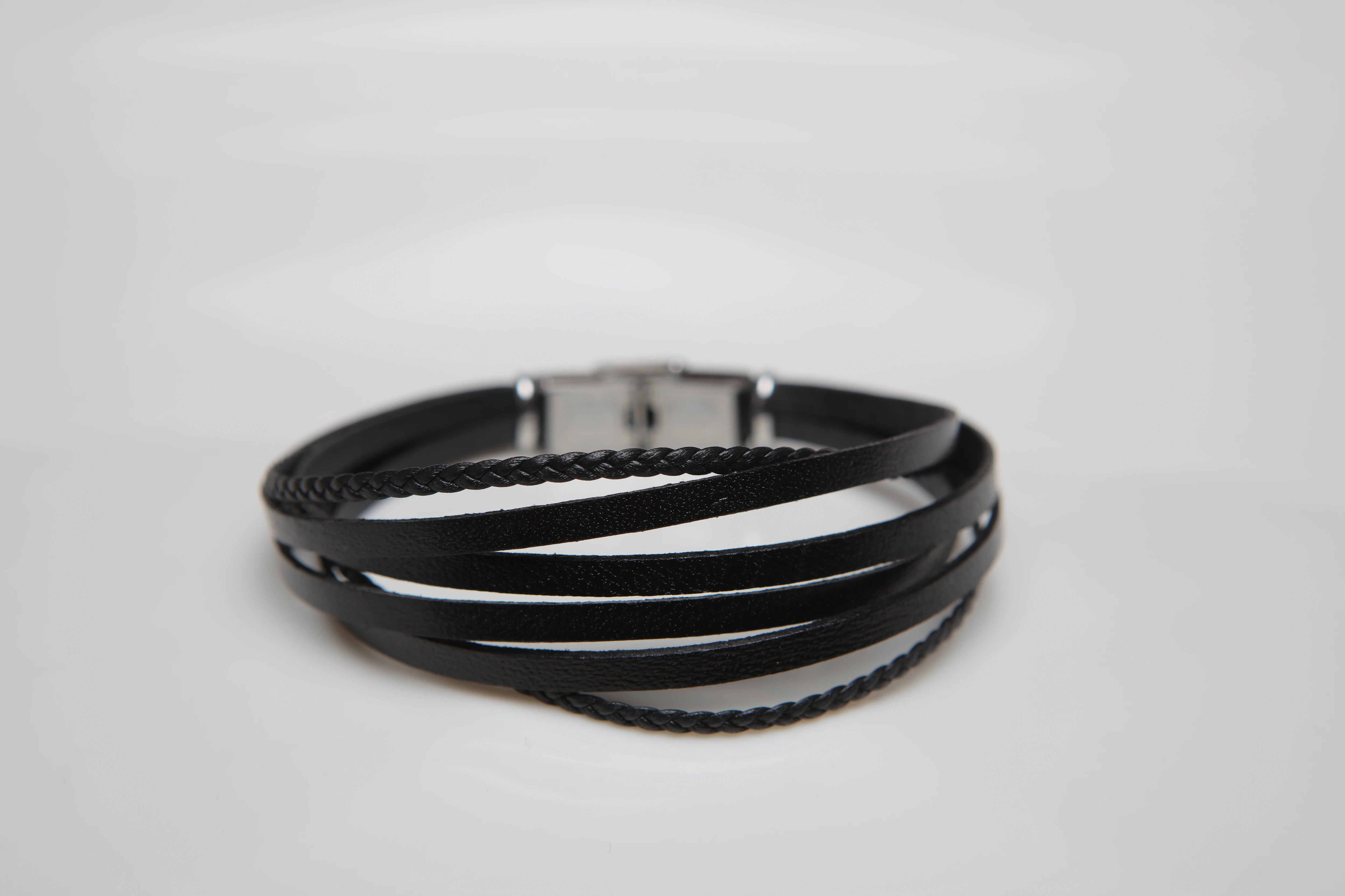 Stainless steel and leather bracelet with multi-strand black braid