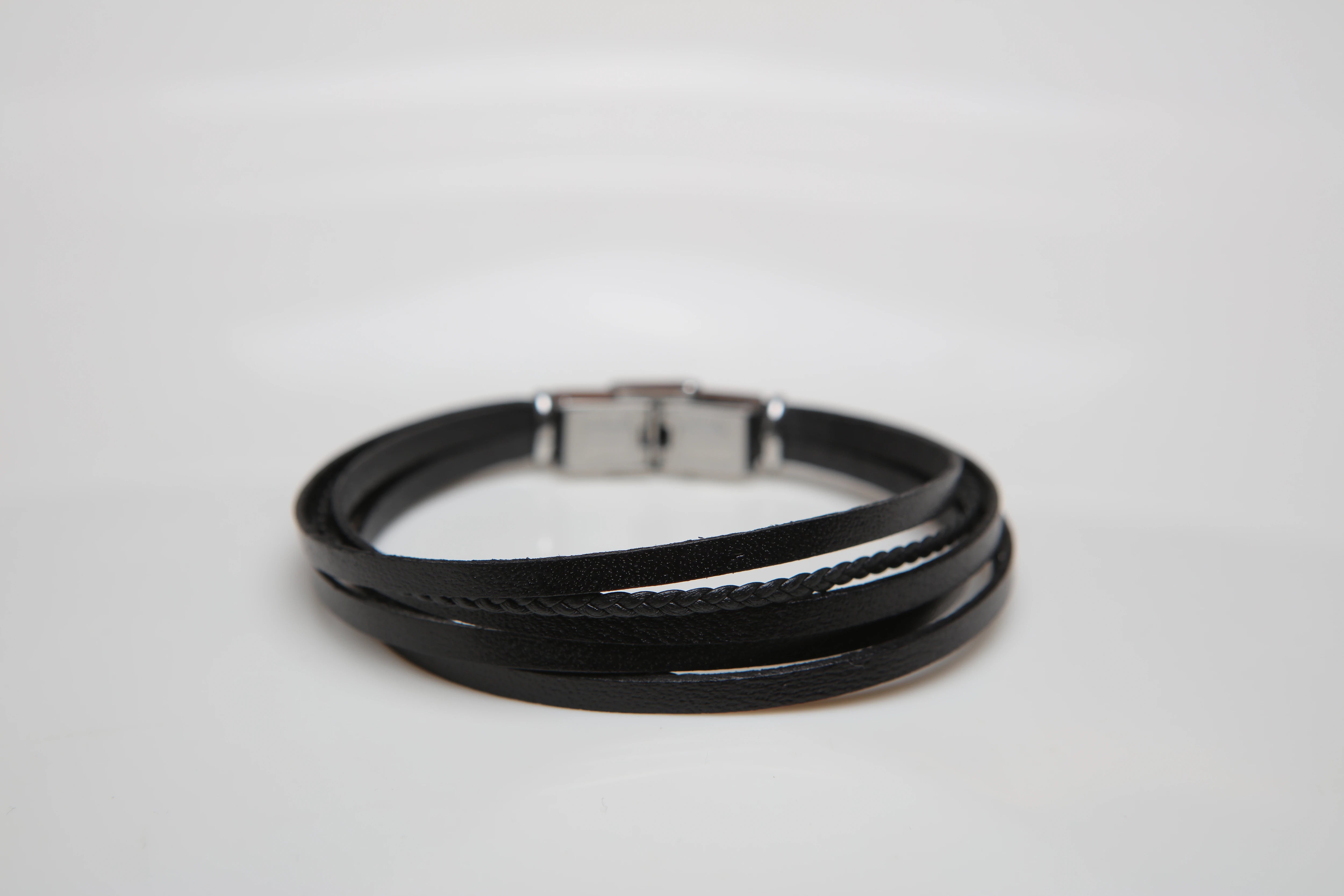 Stainless steel and leather bracelet with multi-strand black braid