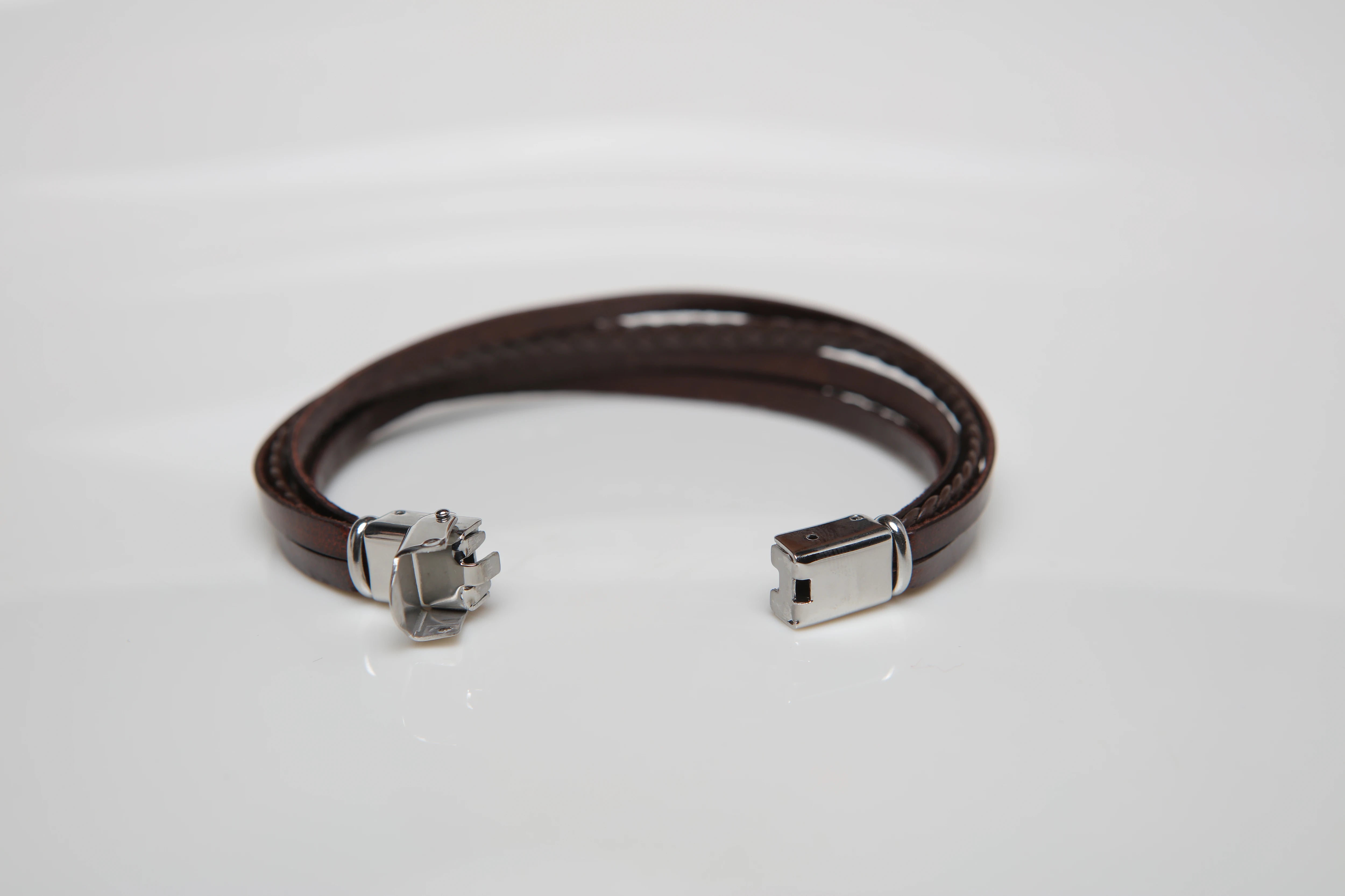 Stainless steel and leather bracelet with multi-strand brown braid