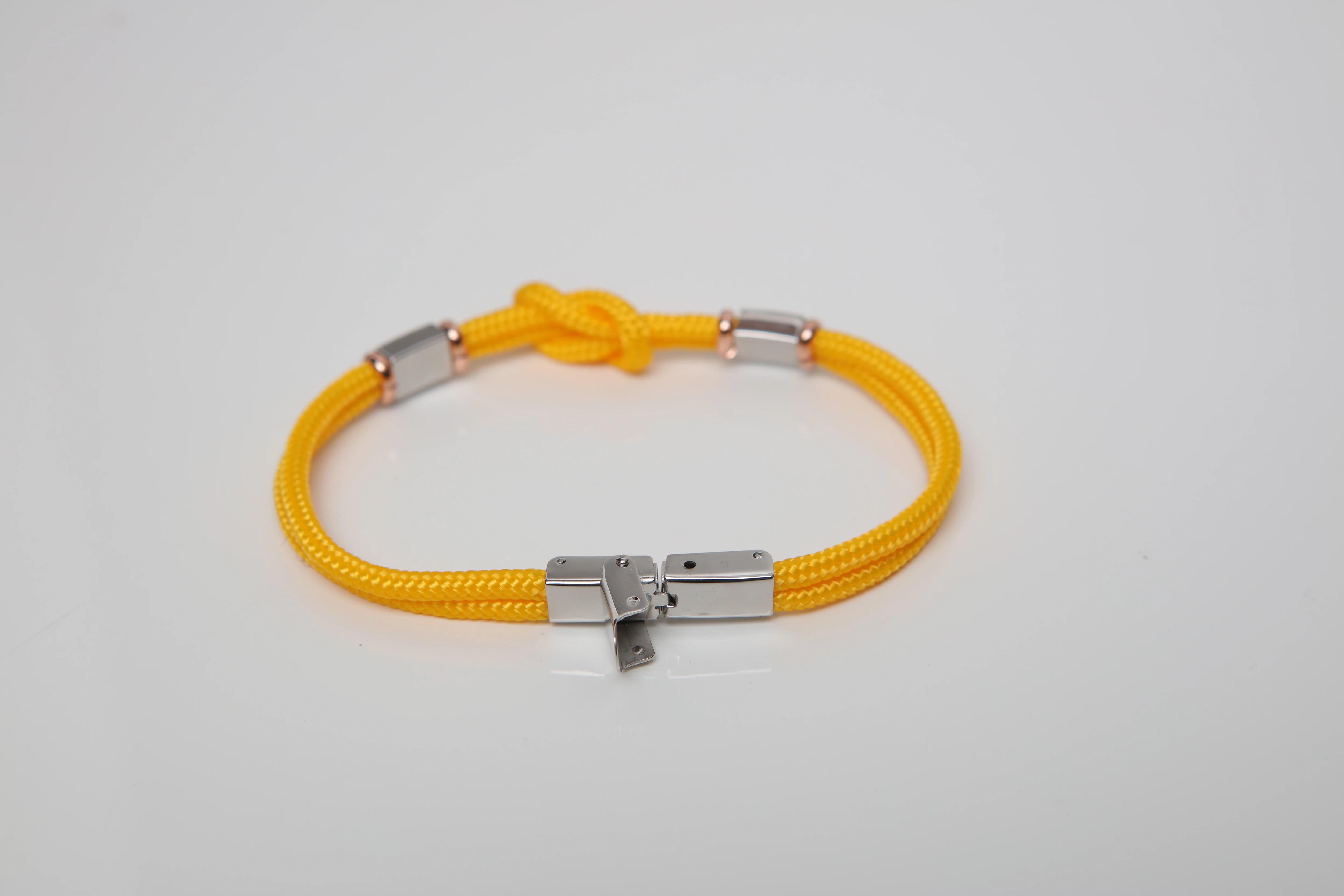 Stainless steel bracelet and yellow nautical rope and flags