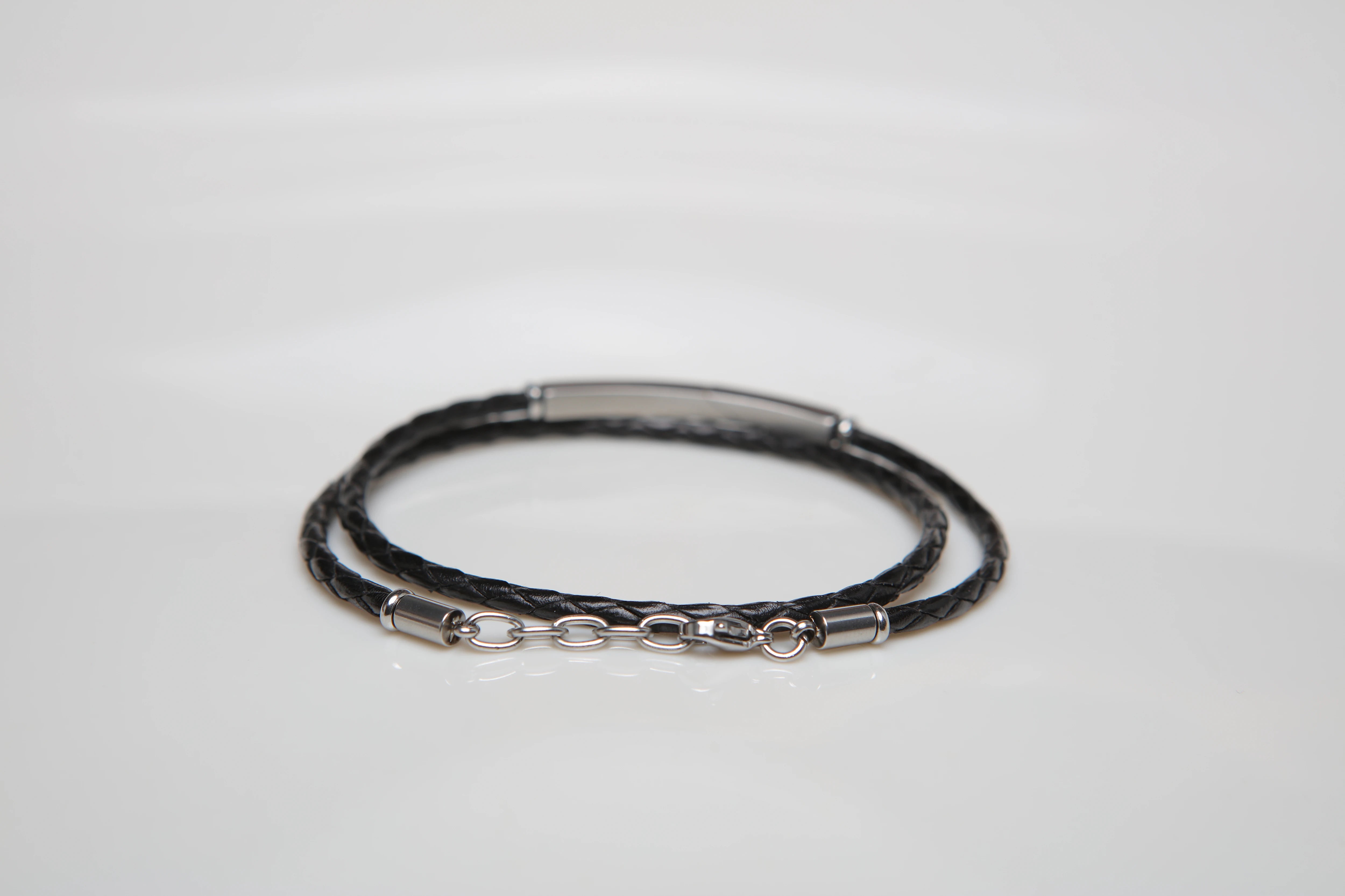 Stainless steel and black leather bracelet two turns with steel plate and 18kt gold screws