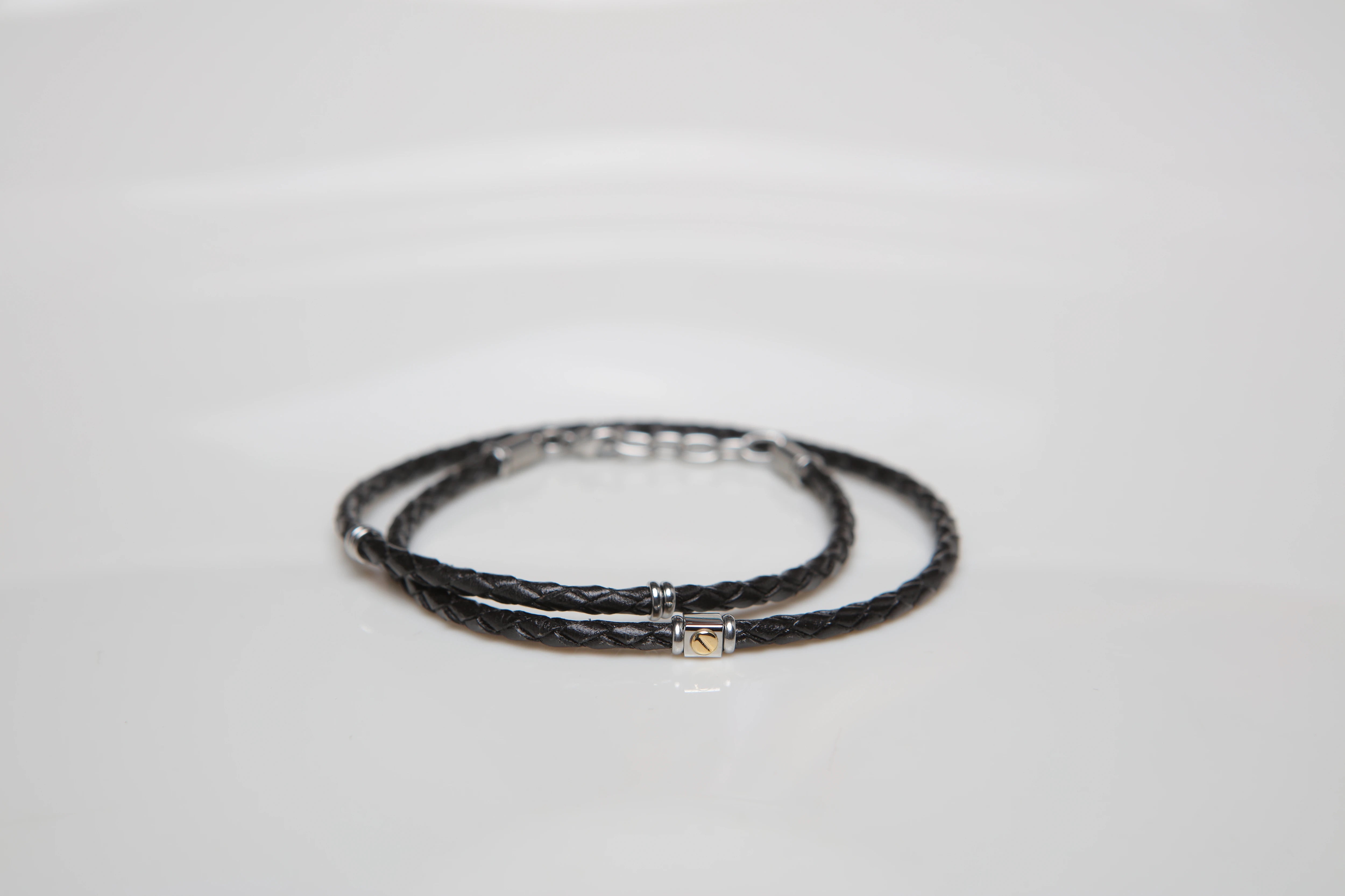 Stainless steel and black leather bracelet two turns with 18kt gold screw