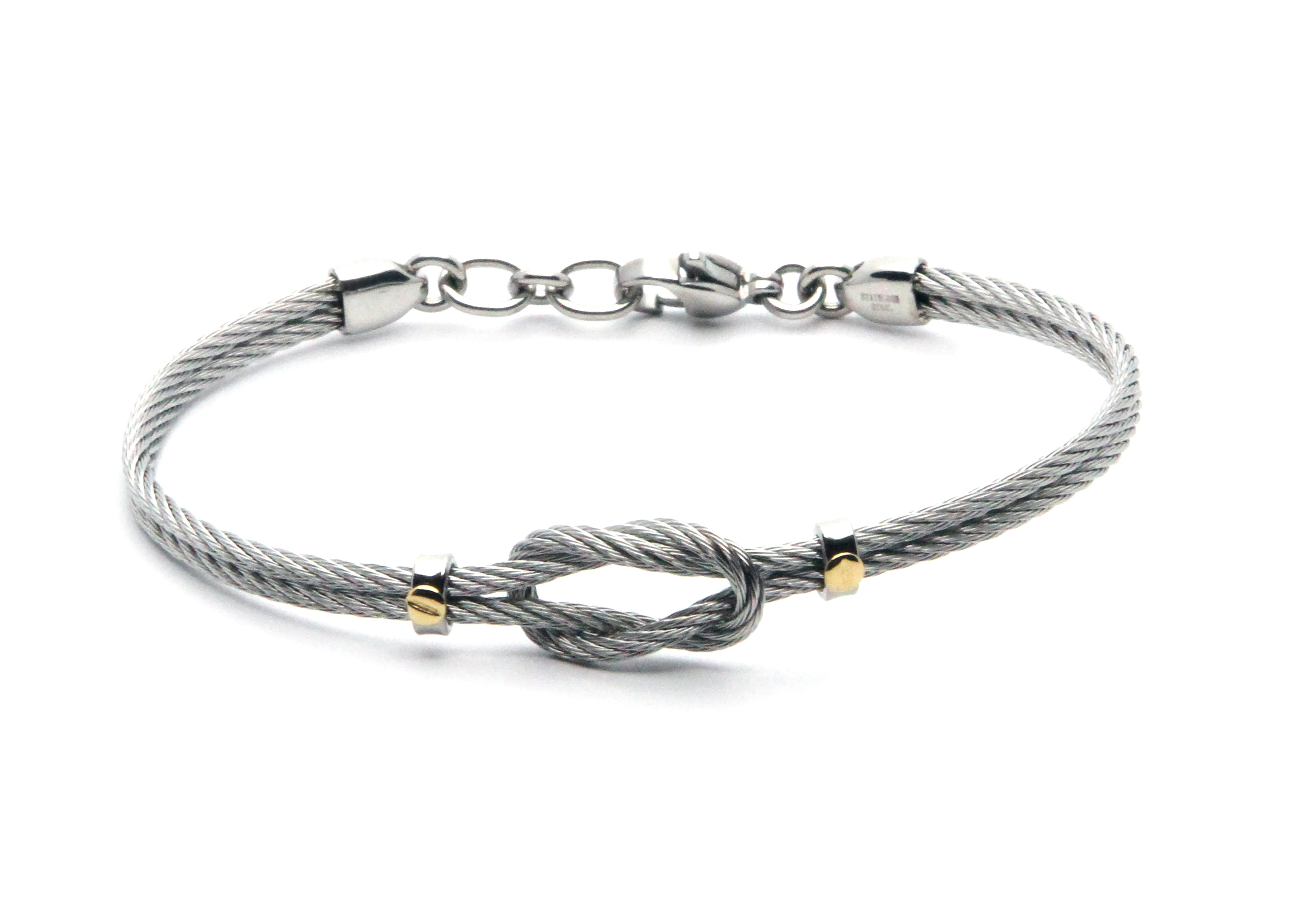 Stainless steel cable bracelet with knot and screws in 18kt gold