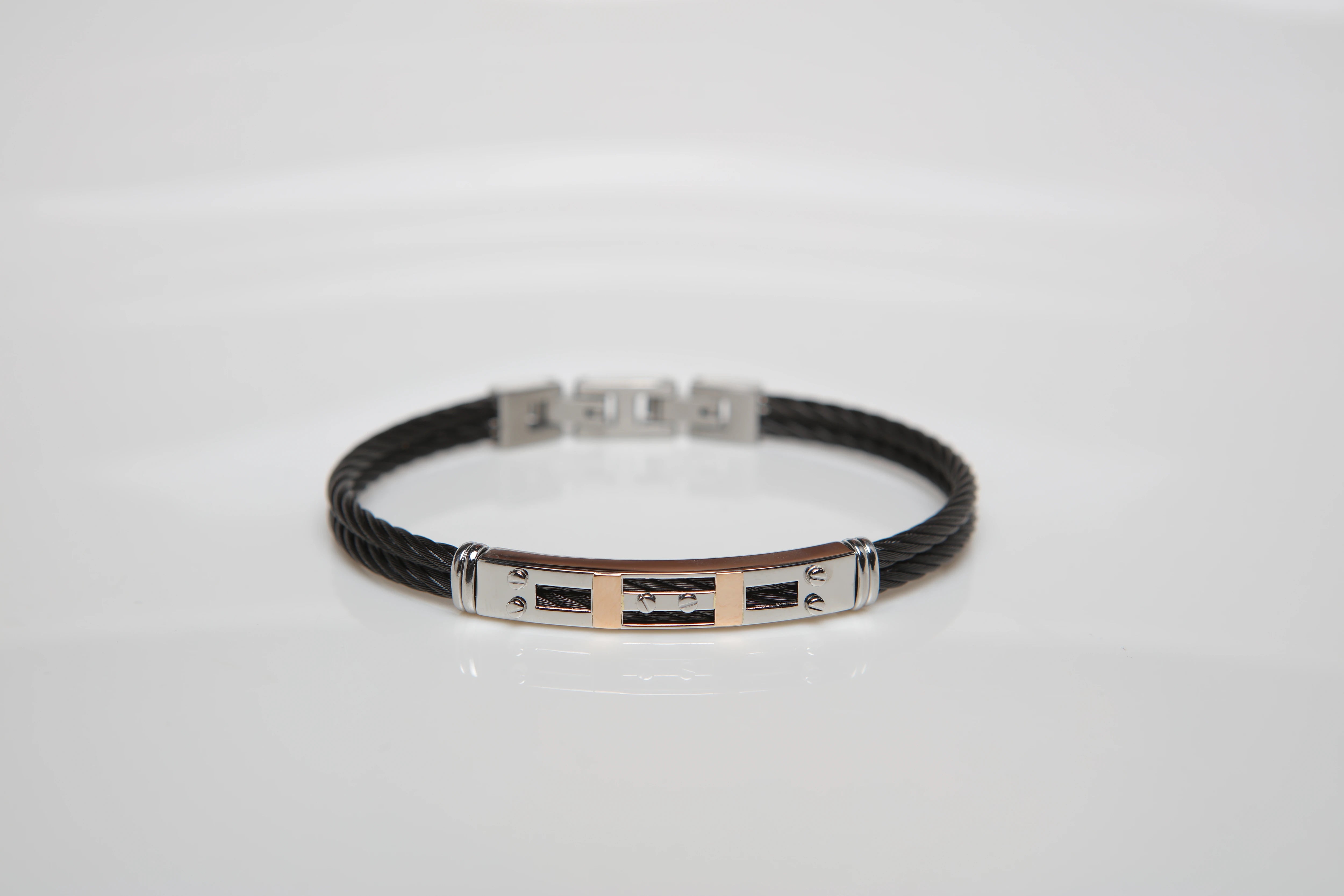 Bracelet with black PVD steel cable with screws and 18 Kt gold inserts