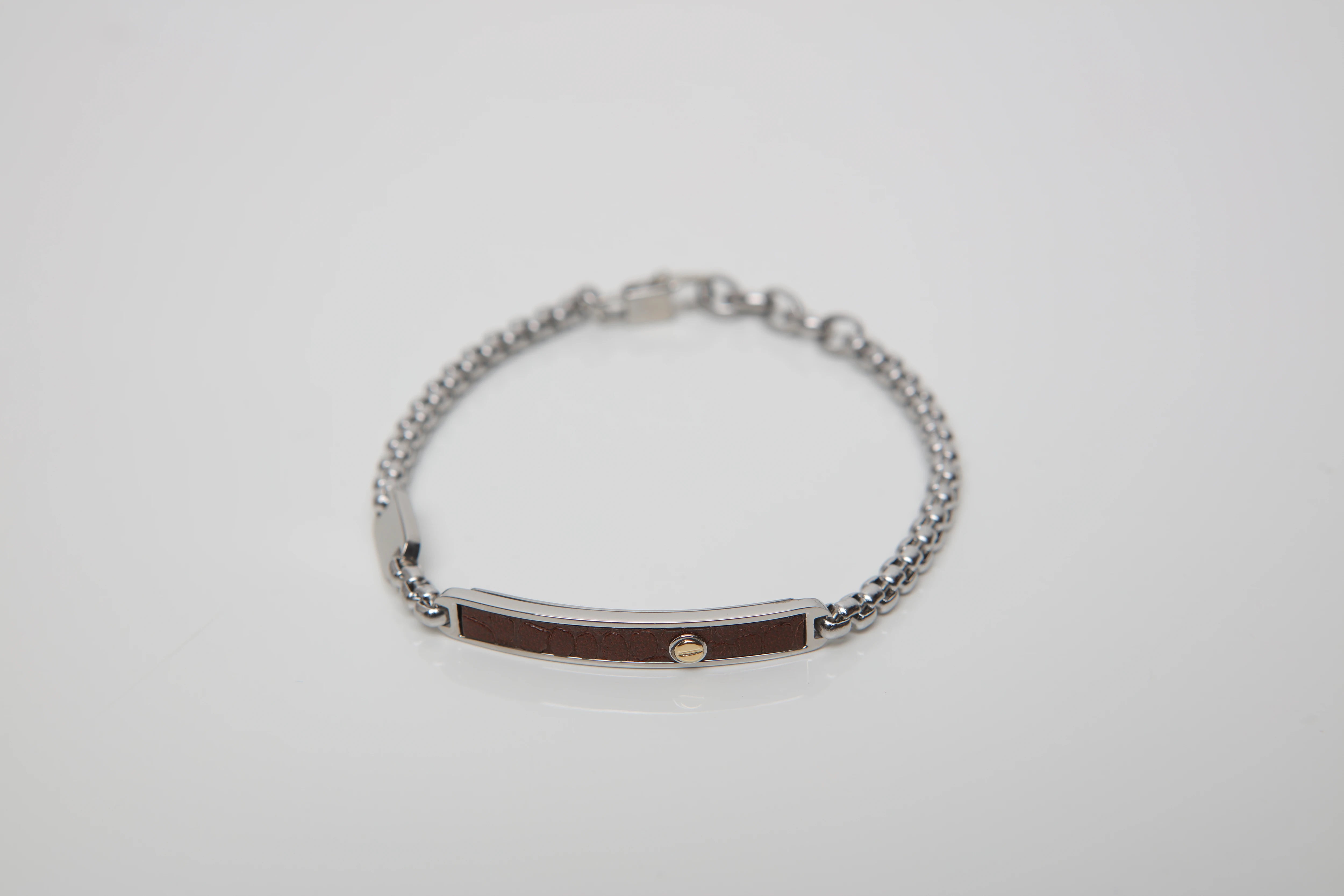 Bracelet with stainless steel chain and leather with brown Texture and gold screw