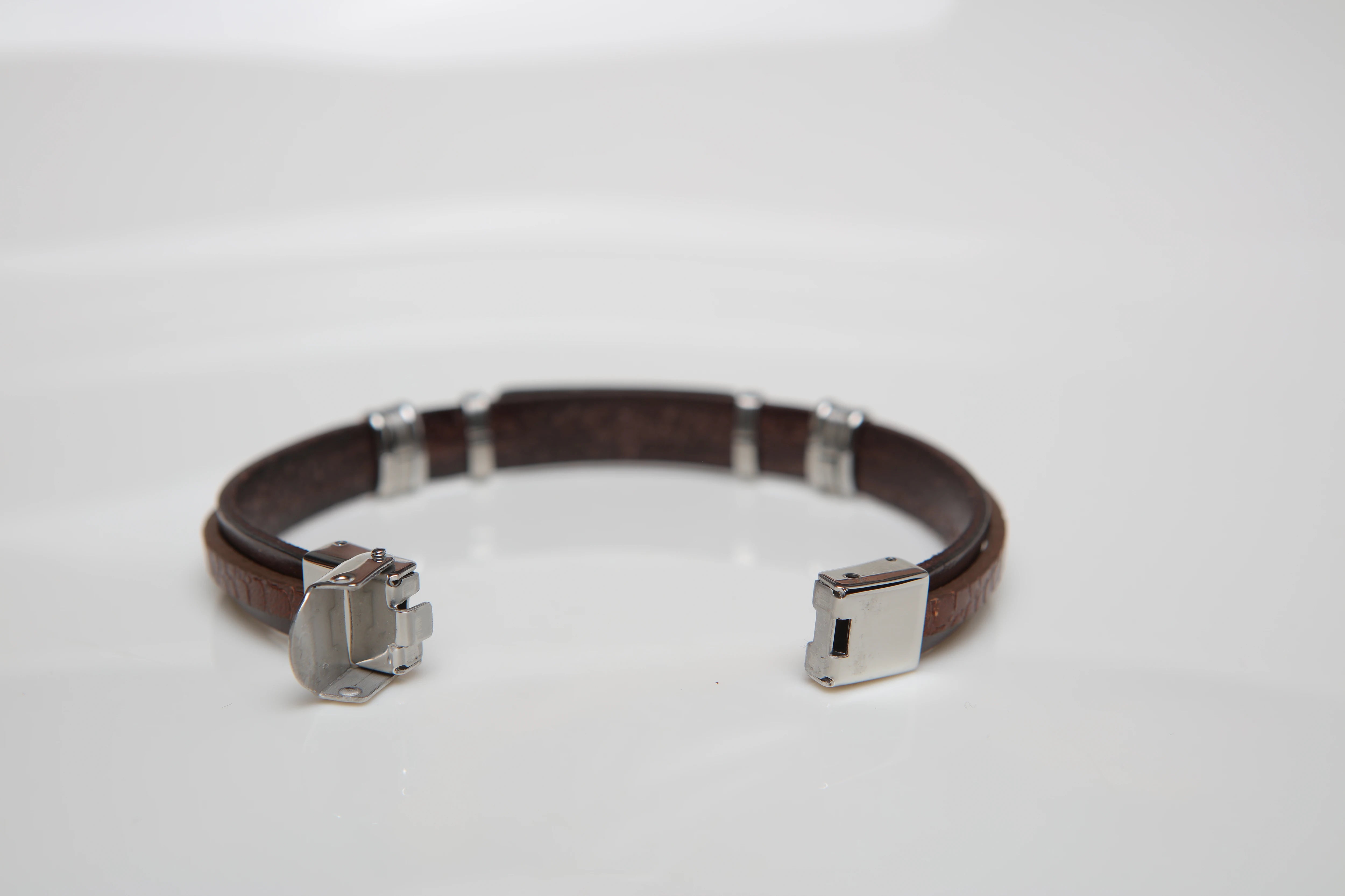 Stainless steel and leather bracelet with brown Texture and gold screw