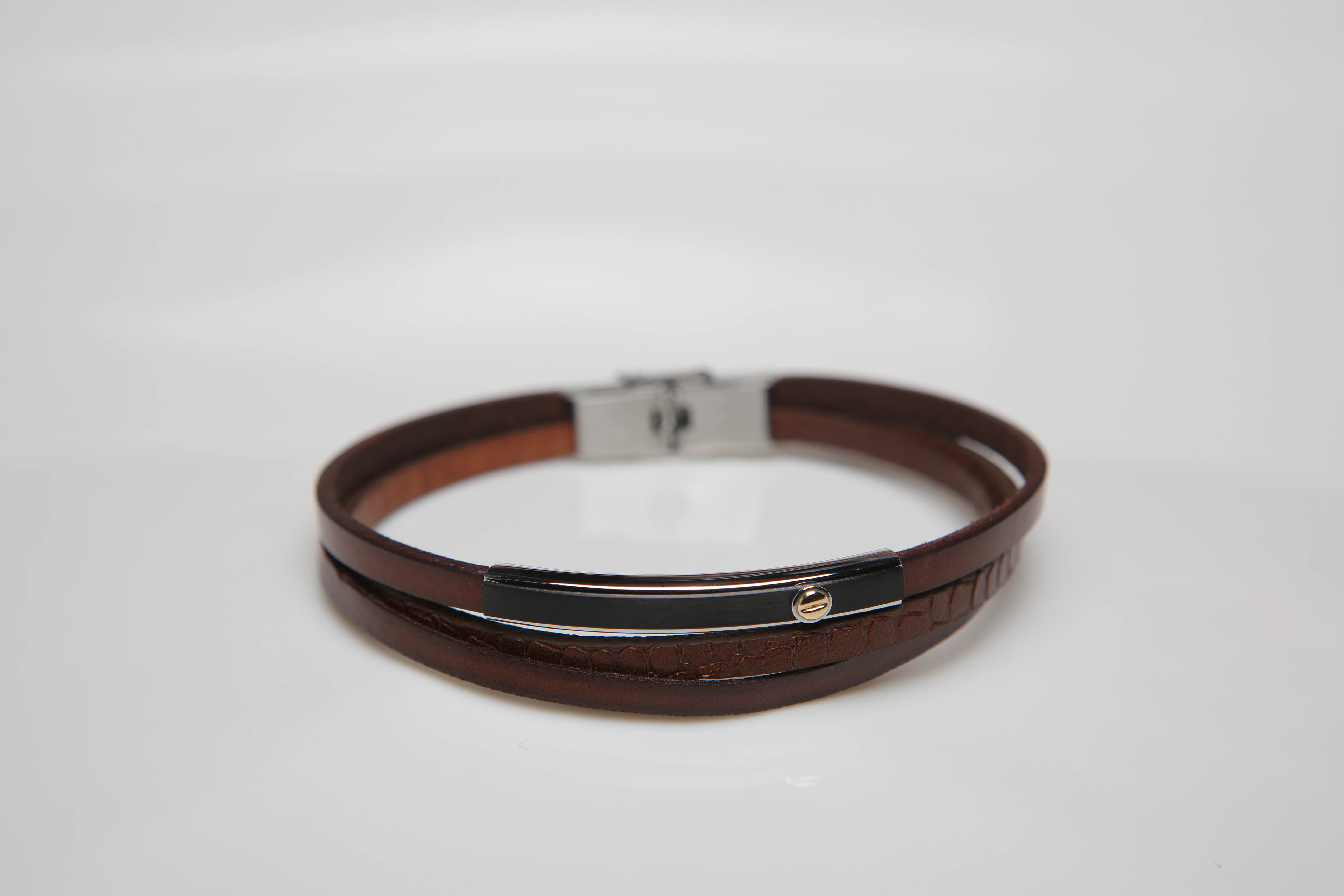 Stainless steel and leather bracelet with brown texture and gold screw