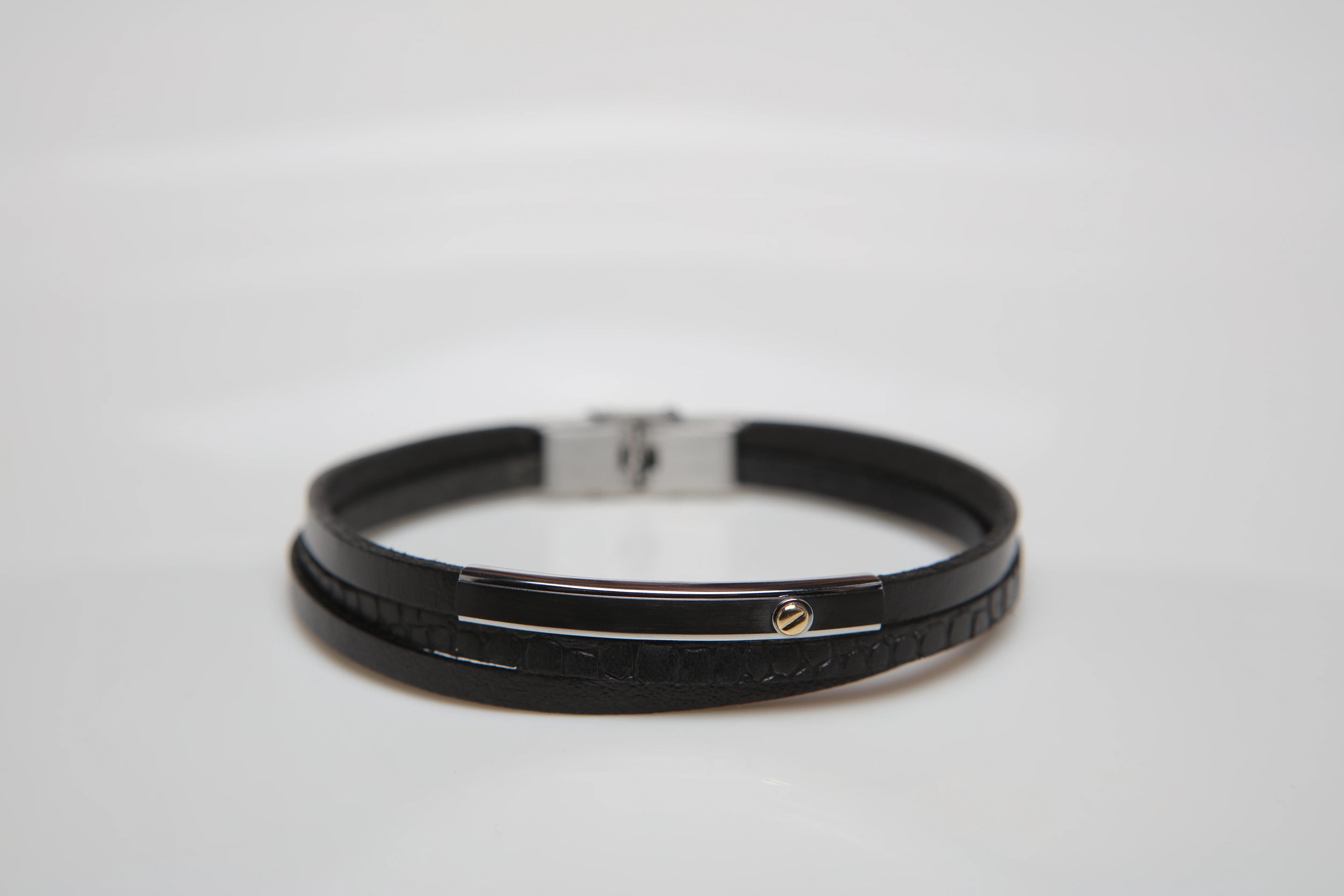 Stainless steel and leather bracelet with black Texture and gold screw