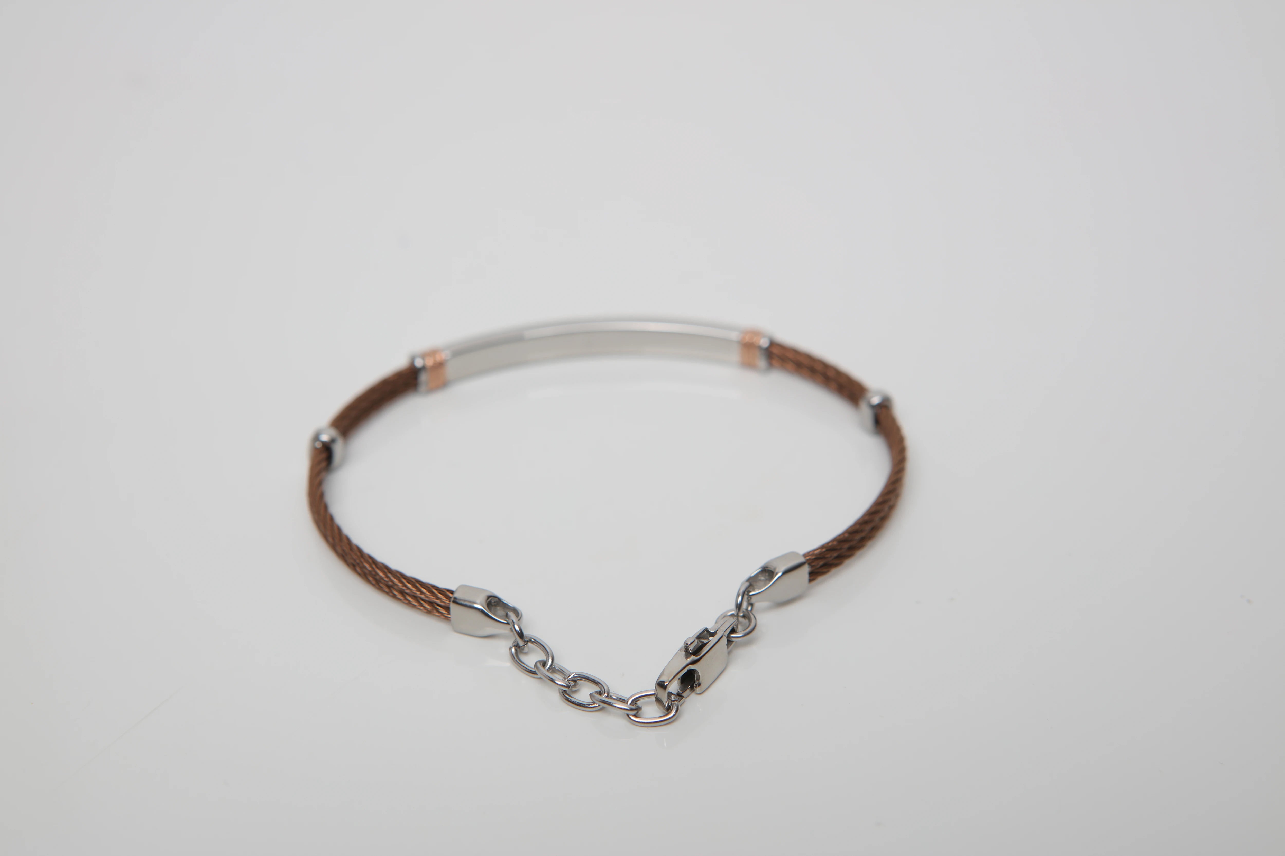 Brown PVD steel cable bracelet with knurled rosé links and Natural Diamond