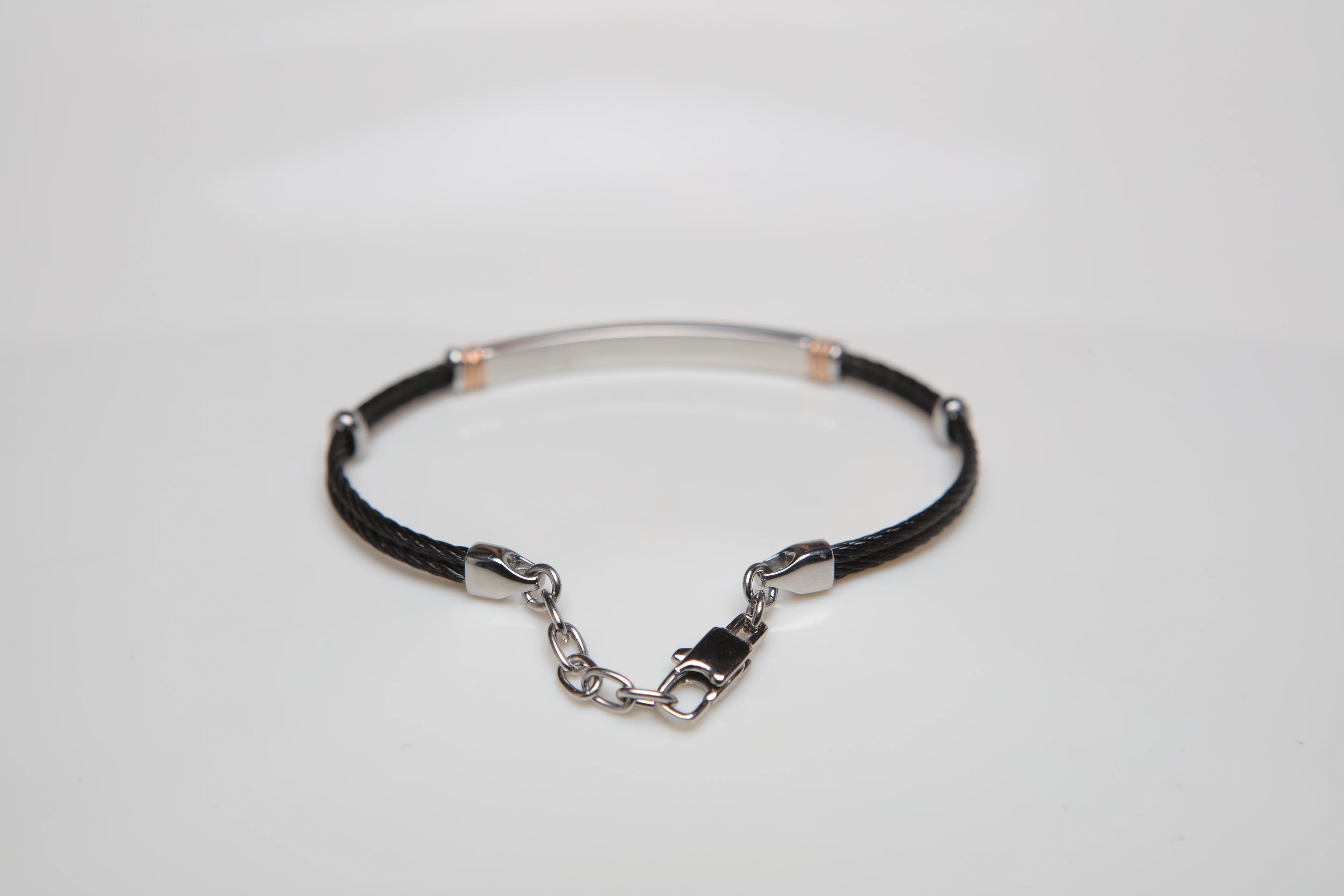 Black PVD steel cable bracelet with knurled rosé links and Natural Diamond