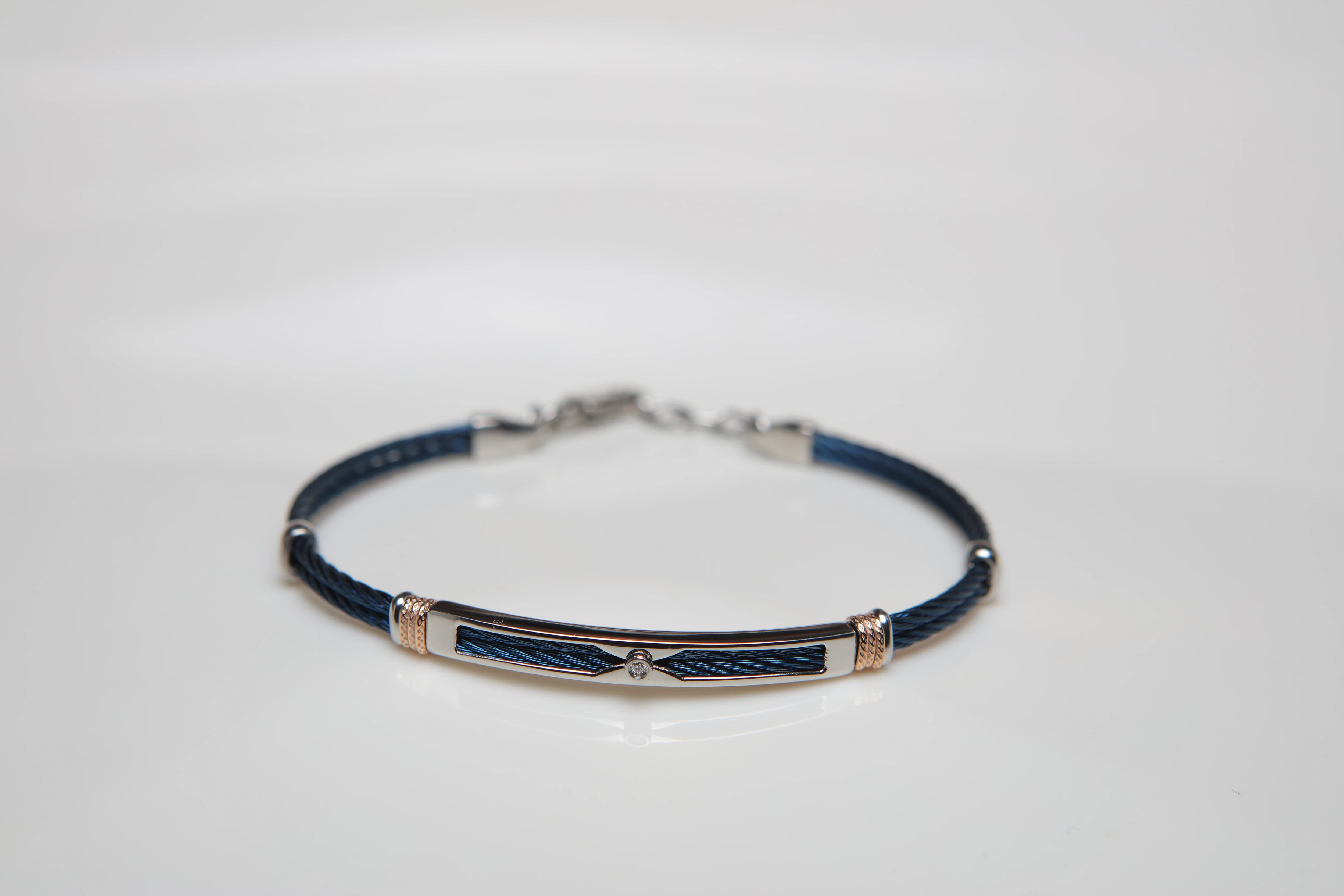 Blue PVD steel cable bracelet with knurled rosé links and Natural Diamond