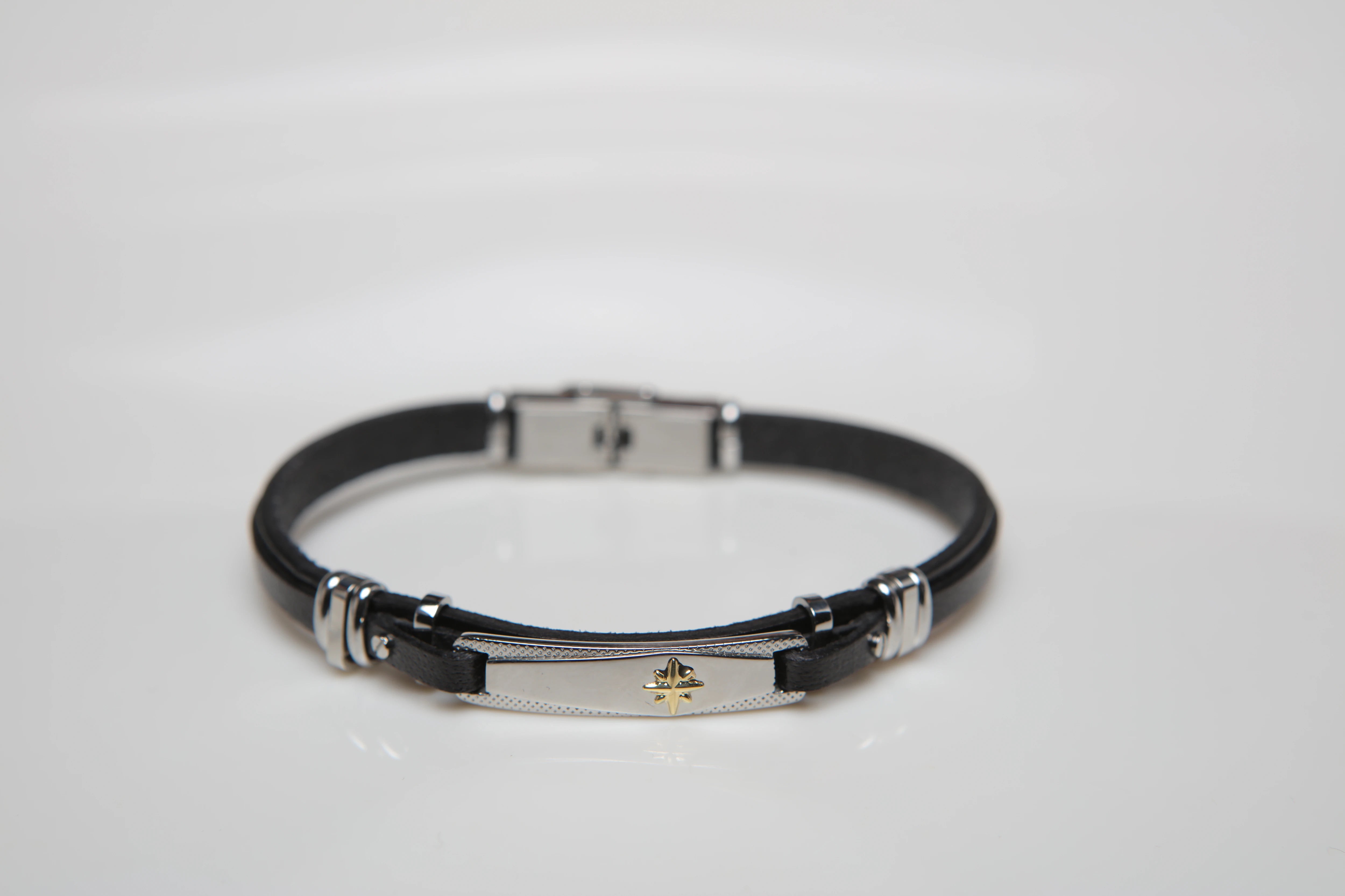 Stainless steel and black leather bracelet with wind rose gold