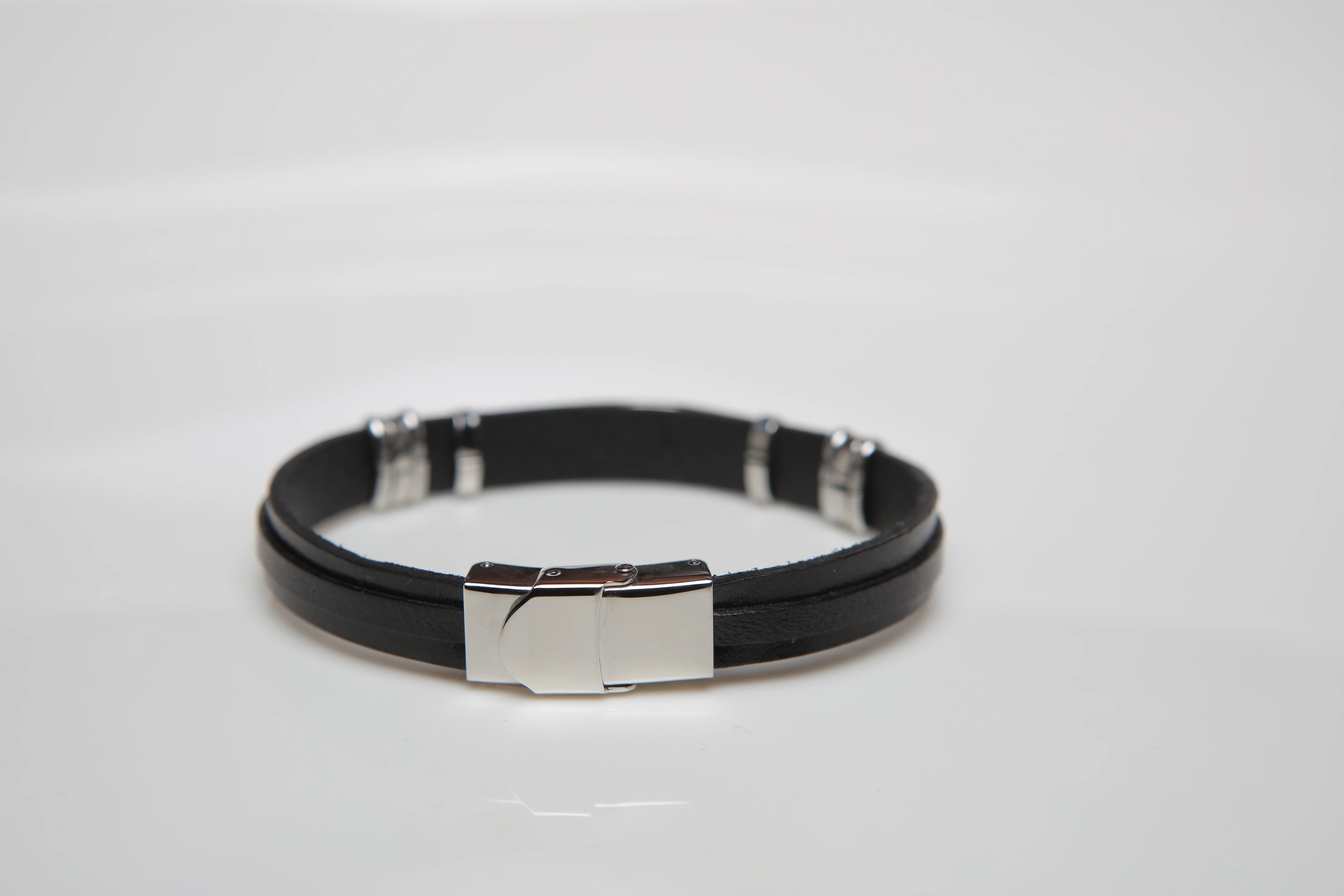 Stainless steel and black leather bracelet with wind rose gold